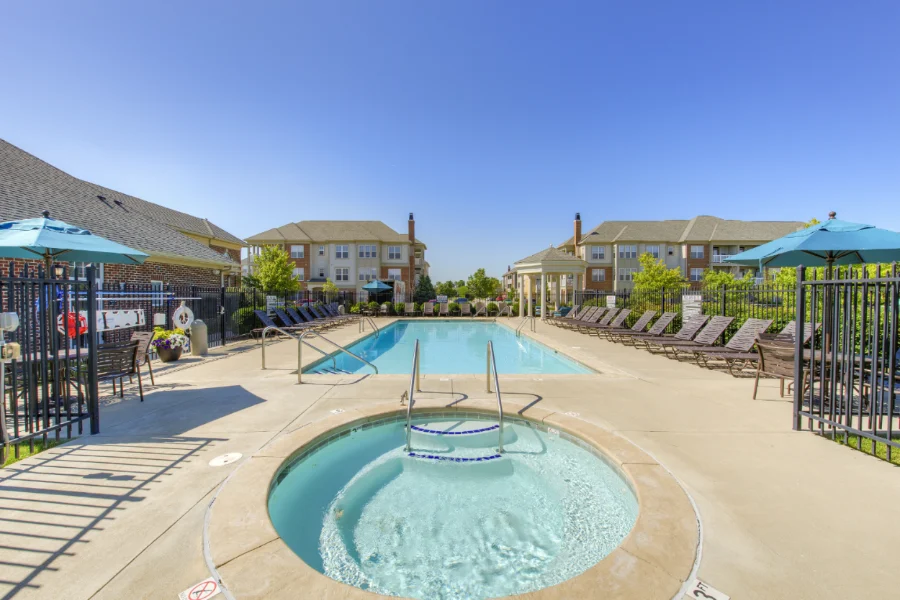 You don't have to give up swimming in the backyard when you move to a community with a pool like The District At Saxony. A clear blue apartment hot tub and swimming pool